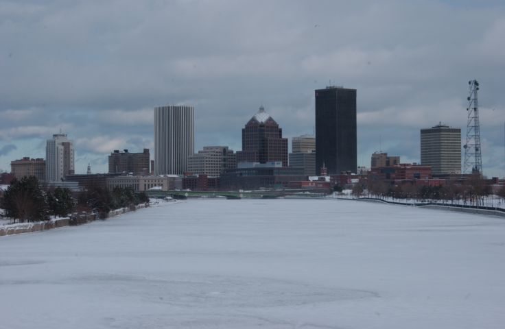 Picture - A frozen Genesee River with Rochester New York Skyline in background.  Fresh 11:30 AM Jan 13th 2004 - Rochester NY Picture Of The Day from RocPic.Com winter spring summer fall pictures photos images people buildings events concerts festivals photo image at new images daily Rochester New York Fall I Love NY I luv NY Rochester New York Jan 2004 POD Winter view picture photo image pictures photos images
