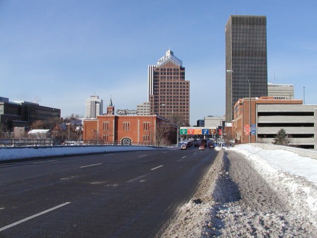 Picture Rochester NY skyline as seen from S Clinton Ave. From Left, Blue Cross Blue Shield, Hyatt Hotel, St Mary's Church Steeple, Geva Theatre, Lincoln Tower, Bausch and Lomb, Frontiernet, Xerox, Midtown Plaza Rochester NY New York City living January 28th 2003 POD I Love NY Rochester NY New York winter Picture Of The Day view picture photo image pictures photos images, January 28th 2003 POD