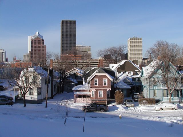 Picture Homes in residential are of Rochester NY share the Rochester New York skyline. From left,  Hyatt Hotel, Saint Mary's Steeple, Lincoln Tower peeking out from behind Bausch and Lomb, Frontiernet foreground of Xerox Tower, Midtown Plaza, and the HSBC building. Rochester NY New York City living January 30th 2003 POD I Luv NY Rochester NY New York winter Picture Of The Day view picture photo image picture pictures photos images, January 30th 2003 POD