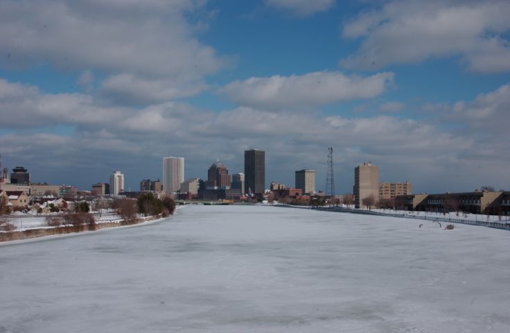 Picture Rochester Skyline, Frozen Genesee River, Clouds and Sunshine. Fresh 12:10 PM Feb 4th 2004 RocPic.Com POD - Rochester NY Picture Of The Day from RocPic.Com winter spring summer fall pictures photos images people buildings events concerts festivals photo image at new images daily Rochester New York Fall I Love NY I luv NY Rochester New York Jan 2004 POD Winter view picture photo image pictures photos images