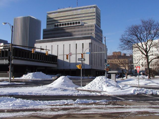Picture a clear path divides a pair of snowbanks at Court St and Chestnut Rochester NY February 19th 2003 POD winter Picture Of The Day view picture photo image picture pictures photos images
