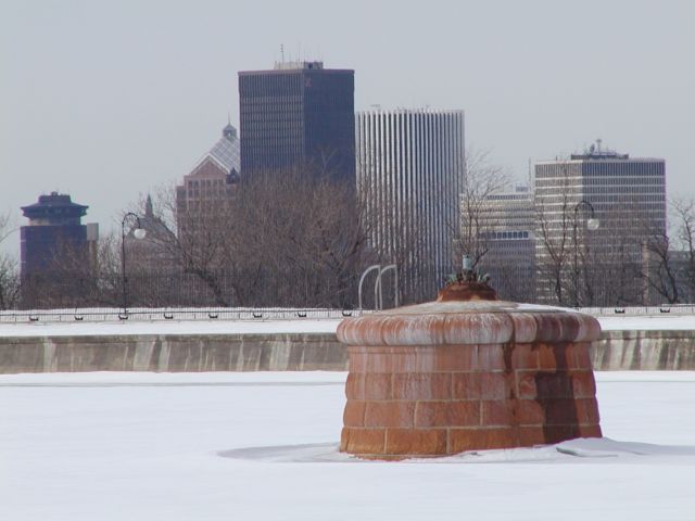 Picture Rochester NY skyline close up view over Cobbs Hill Reservoir Downtown Rochester NY skyline center background. Rochester NY February 24th 2003 POD winter Picture Of The Day view picture photo image picture pictures photos images