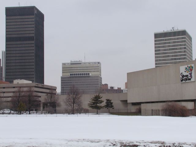 Picture Snow covered lawn forground, Rochester NY skyline with Xerox, Midtown Plaza, HSBC, Frontier Communications, and Strong Museum  Rochester NY winter view. Rochester NY March 3rd 2003 POD winter Picture Of The Day view picture photo image picture pictures photos images