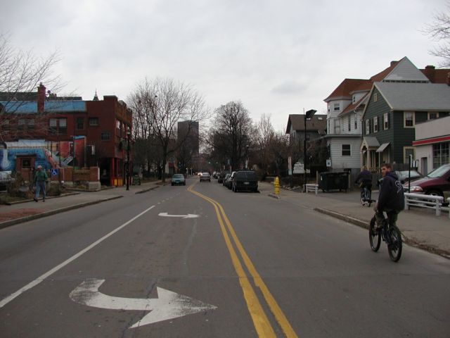 Picture Park Ave people walking, riding bikes, and driving as they enjoy an early spring afternoon. Xerox building visible, Rochester NY March 24th 2003 POD spring Picture Of The Day view picture photo image picture pictures photos images