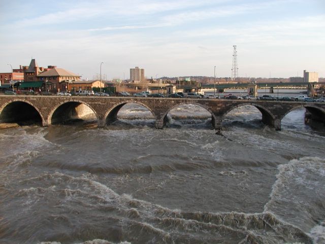 Picture The Genesee River rushes north past the Court St Bridge on it's path to Lake Ontario. Dinosaur Barbeque located top left. Rochester NY New York April 1st 2003 POD spring Picture Of The Day view picture photo image picture pictures photos images