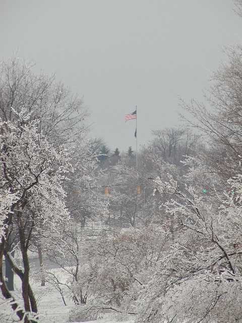 Picture Rochester NY Culver Rd Armory U.S. Flag flying high after the Rochester NY Ice Storm 2003. Cobbs Hill Park view shot April 5th 2003 DigitalSter.Com 64 more images shot on April 4th 2003 and 66 shot April 5th  are at the RocPic.Com web site from the link above or below. Rochester NY New York April 7th 2003 POD spring Picture Of The Day view picture photo image picture pictures photos images