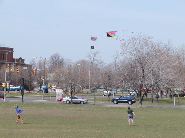 Rochester NY Go Fly a Kite Cobbs Hill Park Rochester NY. A couple enjoys the 81F weather while kite flying at Cobbs Hill Park. Culver Rd Armory for the Army National Guard flying the USA & POW MIA Flag in background. Picture of the Day Spring I Love NY I luv NY Rochester New York April 16th 2003 POD spring view picture photo image pictures photos images