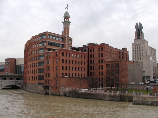 Picture The Genesee River, with Rochester War Memorial, far left, statue of Mercury from the long gone Kimball's Tobacco Works, and the Times building make up part of the background, with Aqueduct Park fronting the west bank of the Genesee, as seen from the grounds of the Rochester Riverside Convention Center's east bank patio. Picture of the Day Spring I Love NY I luv NY Rochester New York April 18th 2003 POD spring view picture photo image pictures photos images