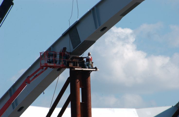 Picture - Bridge Workers Attach Bolts To The New Troupe Howell Bridge. Oct 8th 2005 POD  - Rochester NY Picture Of The Day from RocPic.Com spring summer fall winter pictures photos images people buildings events concerts festivals photo image at new images daily Rochester New York Fall I Love NY I luv NY Rochester New York 2005 POD view picture photo image pictures photos images