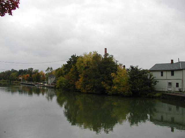 Picture Fairport NY New York Public Boat Launch Photo View From Lift Bridge Over Erie Canal Looking at the trail or path on the North side of the Erie Canal as it heads West to Rochester NY.  Trees on both sides of the Erie Canal display Fall colors October 2002 Rochester NY New York 