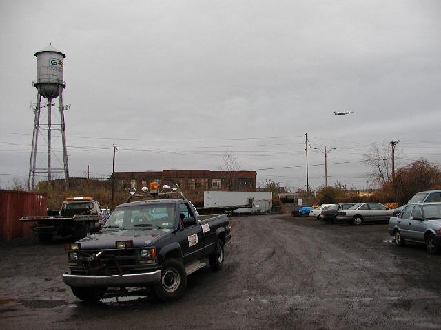 Picture Of The Day Rochester NY New York November 20th 2002 Water Tower At Junk Yard On Cairn Airplane Landing Jet Plane Airport Street Photo Photos Pictures Image Images