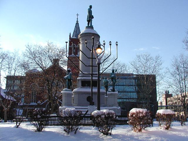 Rochester NY New York December 5th 2002 POD Snowy Afternoon Washington Square Park A Chanukah Menorah Statue Of Abraham Lincoln And Cross Topped Church Steeple Share Late Fall Blue Sky Rochester NY Picture Of The Day Photo Photos Pictures Image Images