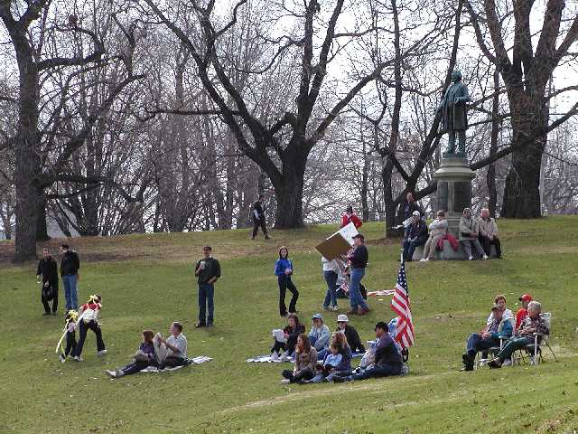 Saturday April 19th 2003, yellow ribbons, USA flags, and Americans gather around stature of Frederic Douglas in Highland Park for Rochster NY radio station 1180 WHAM's Rally 'Round America celebration. Image 5 of 60  -  73 kB