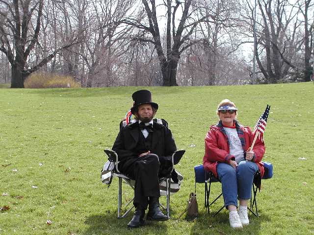 You are viewing real Americans, they are enjoying their freedom by relaxing in a park on a beautiful spring day, while showing support for the country they love, and the people who defend the country they love.  The Mrs. informed me that Honest Abe would be speaking Memorial Day 2003 in East Rochester NY Image 10 of 60  -  64 kB