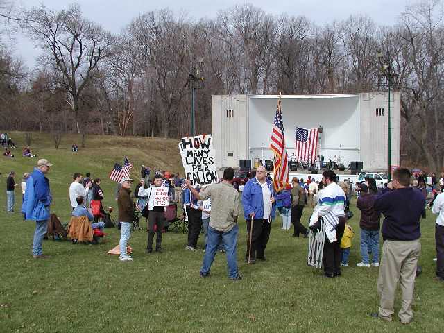 Attention American Military Personel, people who love you, and care about you, are worried that if you see images of protest in the USA that you will think Americans do not support you.  Be proud, and rest assured, well over 70% of Americans think this protester is a MORON. The crowd wanted to know how many gallons of gas it took him to be at the rally, but I didn't catch an answer... Image 12 of 60  -  53 kB