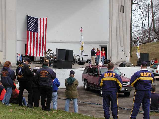 WHAM's Bill Lowe introduces the Rally Round America, National Anthem singers, locals Rhian, and Cara Morgan, of American Idol fame... Image 34 of 60  -  43 kB