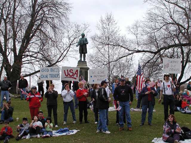 You are viewing Americans, having a great time while in support of their country and those who defend America. Rally 'Round America, Rochester NY, Highland Park, April 19th, 2003. Image 45 of 60  -  72 kB