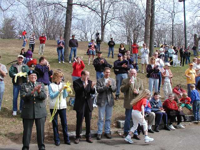 You are looking at a mighty fine group of Americans. Regular viewers of my photos know that this posting is the first ever where I have included text on each photo page. Some might accuse me of hyperbole, but I assure YOU the viewer, that the Americans you have been viewing are some of the most peace loving people on the face of the earth.  Included in the foreground of this photo on the left in uniform, Army Chaplin, Father Elmer Heindl, and on the right with the water bottle is Congressional Medal of Honor recipient, Gary B. Beikirch, Rally 'Round America WHAM host Bob Lonsberry is to the left of Mr. Beikrich. All those other people, are good Americans much more interested in world peace than main stream media seems to want to talk about. Image 58 of 60  -  69 kB